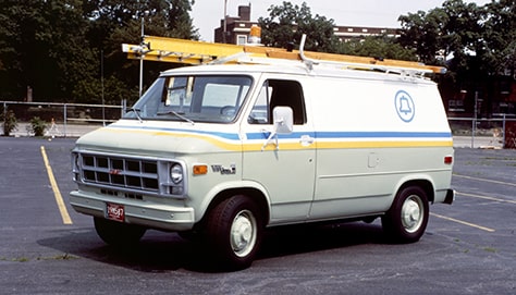 Three Quarters View of a White Chevy Van in a Parking Lot