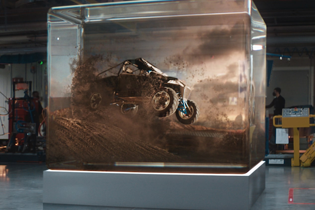 Side View of a Car Going through a Desert Projected inside a Transparent Box