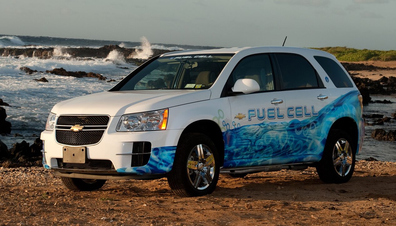 Three Quarters View of a 2007 Chevy Equinox Fuel Cell SUV Parked in Front of a Scenic Ocean