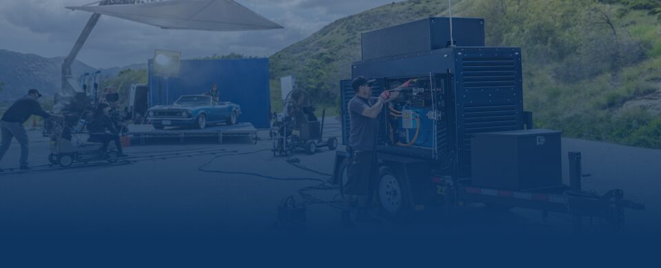 A Crew Works on a Hydrogen Fuel Cell Station Outdoors Under a Sunny Sky