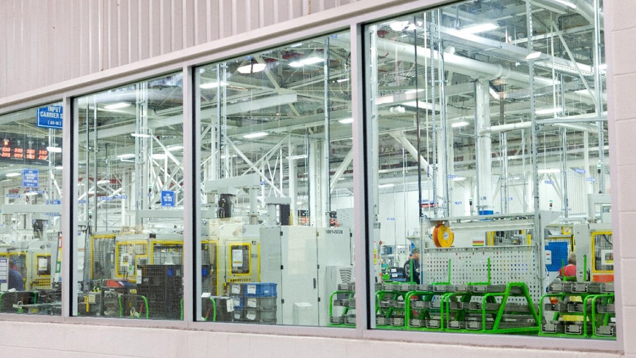 A Shot of a Glass Window Showing the Interior of a Warehouse